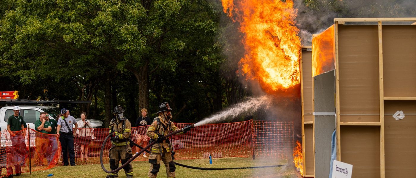 Firefighters put out fire during fire safety demonstration